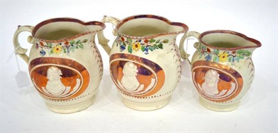 Lot 307 - A Pair of Queen Caroline Commemorative Pink Lustre Jugs, circa 1820, moulded with bust...