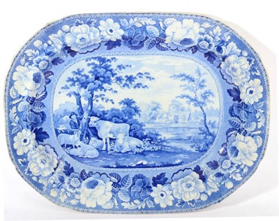 Lot 315 - A Staffordshire Pearlware Meat Platter, circa 1820, printed in underglaze blue with a cowherd,...
