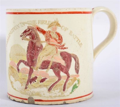 Lot 328 - A Creamware Napoleonic Commemorative Mug, circa 1812, printed and overpainted with MARQ'S...