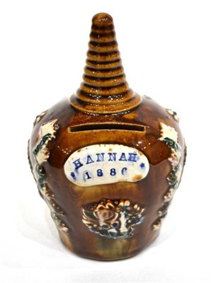 Lot 332 - A Measham Bargeware Money Box, dated 1886, of baluster form with ribbed conical finial,...
