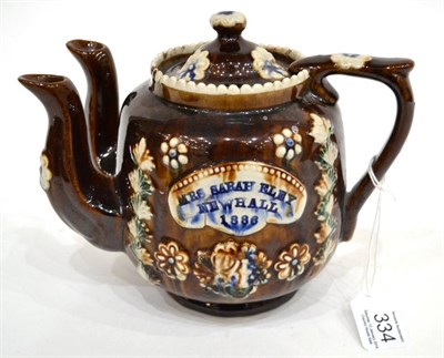 Lot 334 - A Measham Bargeware Twin-Spouted Teapot and Cover, dated 1886, of ovoid form, inscribed MRS...
