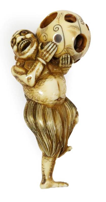 Lot 408 - A Japanese Ivory Netsuke, Edo period, carved as a South Sea islander wearing a grass skirt...