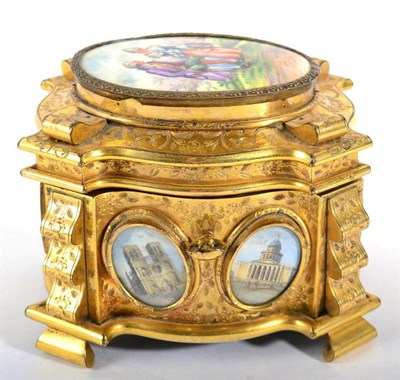 Lot 1011 - A French Gilt Metal Casket and Hinged Cover, late 19th century, of shaped oval form, inset with six