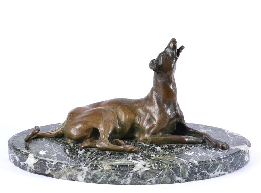 Lot 1012 - French Animalier School (early 20th century): A Bronze Figure of a Recumbent Hound, on a marble...