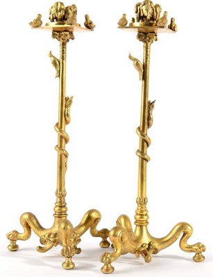 Lot 1014 - A Pair of Gilt Bronze Candlesticks, 19th century, with leaf cast sockets on squared drip pans...