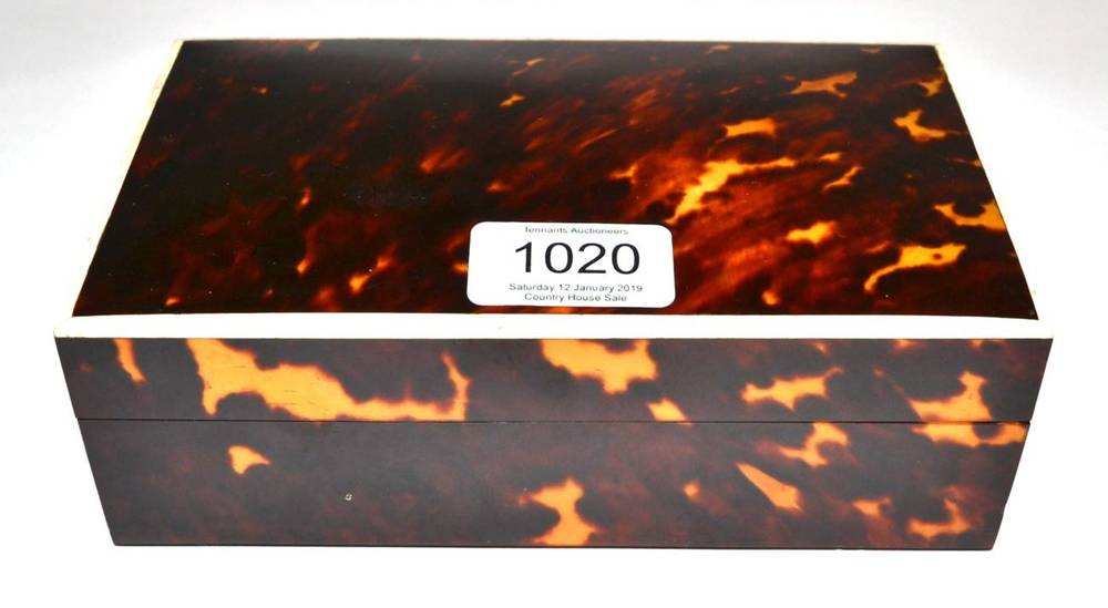 Lot 1020 - A Tortoiseshell and Ivory Banded Cigarette Box, 1920s, of rectangular form, 19cm wide