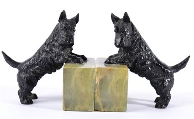 Lot 1024 - A Pair of Art Deco Austrian Cold Painted Bronze Scottish Terrier Dog Bookends, mounted on Brazilian