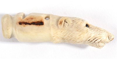 Lot 1026 - A Carved Horn Dog Whistle, circa 1900, in the form of the head of a hound with glass eyes, 7cm long