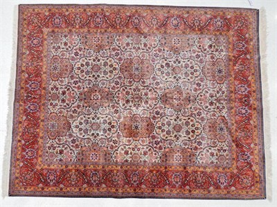 Lot 1179 - Kashan Design Carpet Probably India, circa 1970 The ivory lattice field of plants and flowers,...