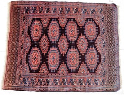 Lot 1184 - Saryk Rug North West Afghanistan, circa 1920 The chocolate field of Salor güls enclosed by...