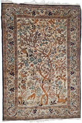 Lot 1185 - Ghom Silk Rug Central Iran, circa 1960 The ivory field with trees, birds and animals enclosed...