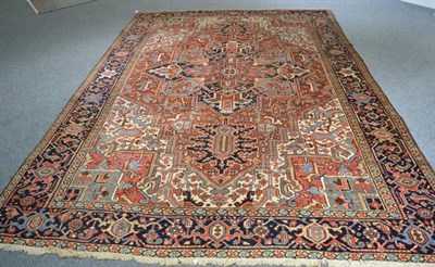 Lot 1186 - Heriz Carpet Iranian Azerbaijan, circa 1920 The chestnut field of angular vines with indigo central