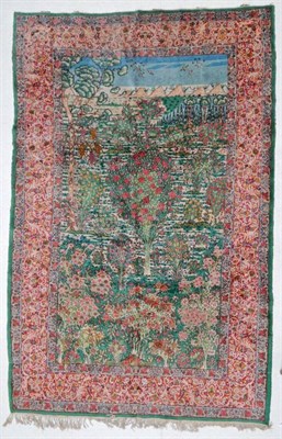 Lot 1187 - Kirman Pictorial Carpet South East Iran, circa 1950 The polychrome field enclosed by meandering...