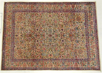 Lot 1191 - Kirman Carpet South East Iran, 20th century The ivory field with an allover design of...