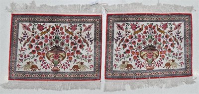Lot 1194 - Pair of Ghom Silks Mats  Central Iran, late 20th century Each with an ivory field centred by an urn