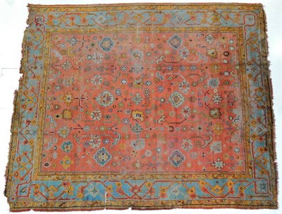Lot 1198 - Ushak Carpet West Anatolia, circa 1900 The soft peach field with an all over design of stylised...