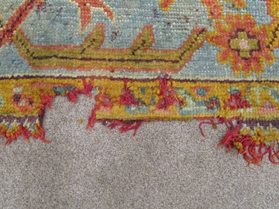 Lot 1198 - Ushak Carpet West Anatolia, circa 1900 The soft peach field with an all over design of stylised...