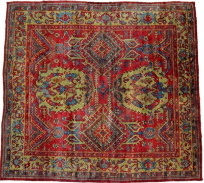 Lot 1199 - Ushak Carpet Central/West Anatolia, circa 1900 The tomato red field with columns of diamond and...