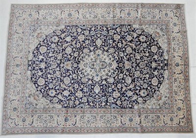 Lot 1200 - Nain Part Silk Carpet Central Iran, circa 1960 The indigo field of scrolling vines around a...