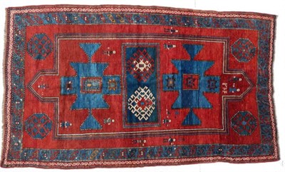 Lot 1209 - Kazak Rug Central Caucasus, circa 1900 The crimson double niche field with central panel containing