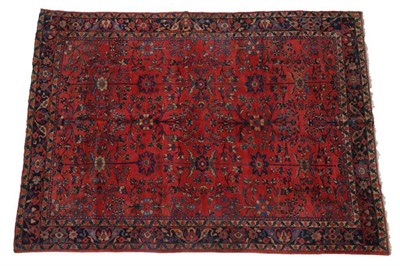 Lot 1210 - Mahal Carpet West Iran, circa 1920 The strawberry field of stylised plants and vines enclosed...