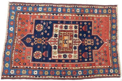 Lot 1212 - Kazak Rug Central Caucasus, late 19th century The madder field with anthropomorphic and...