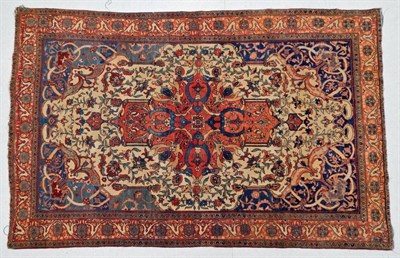 Lot 1213 - Saroukh Rug  West Iran, late 19th century The ivory field of scrolling vines around a...