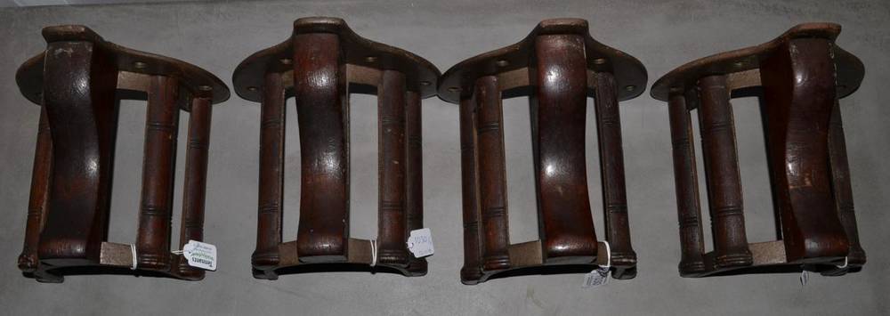 Lot 1030 - A Set of Four Cast Iron and Mahogany Musgrave's Patent Bridle Racks, early 20th century, with...