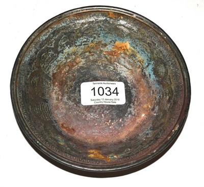Lot 1034 - A Persian Patinated Metal Medicine Dish, in 14th/15th century style, decorated with panels of...