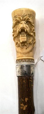 Lot 1067 - A Victorian Silver and Japanese Ivory Mounted Walking Stick, London 1885, the handle carved in...