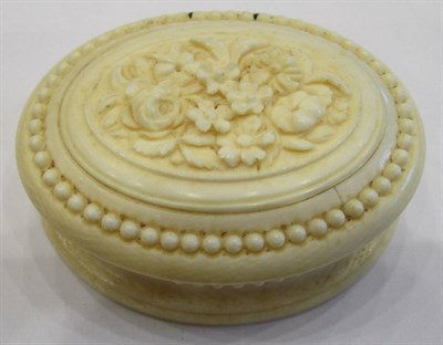 Lot 1073 - A Dieppe Ivory Oval Box, mid 19th century, the hinged cover carved with foliage, 6.5cm wide