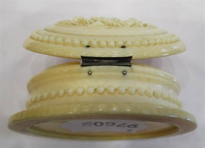 Lot 1073 - A Dieppe Ivory Oval Box, mid 19th century, the hinged cover carved with foliage, 6.5cm wide