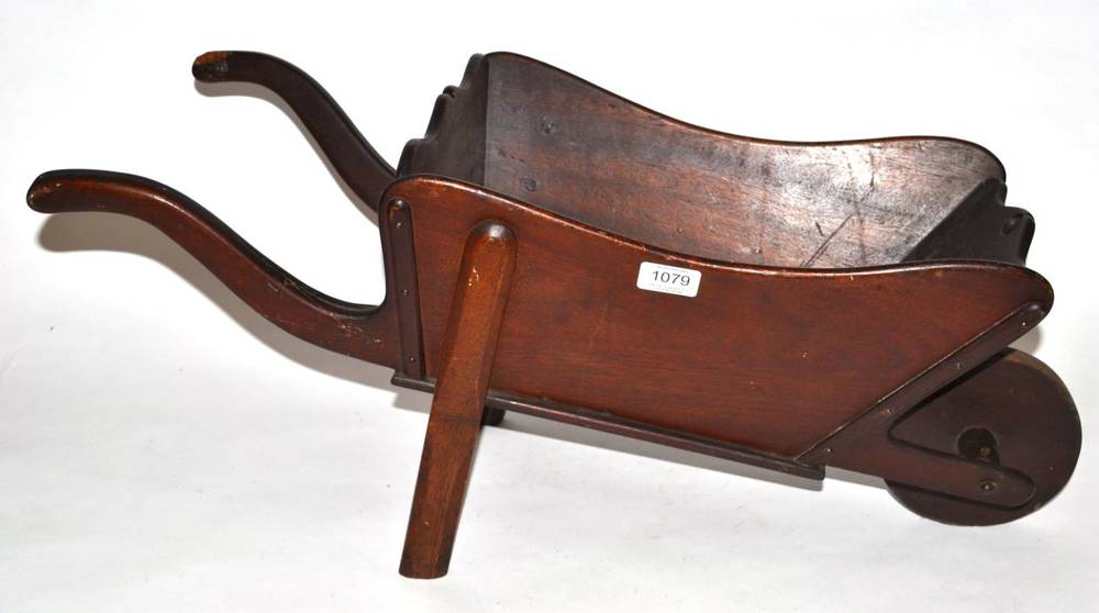 Lot 1079 - A Child's Mahogany Wheelbarrow, mid 19th century, with ogee rim and curved handles, initialled...