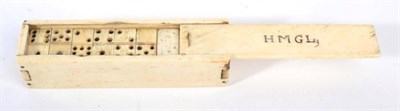 Lot 1082 - A Prisoner of War-work Bone Boxed Set of Dominos, 19th century, the sliding cover initialled...
