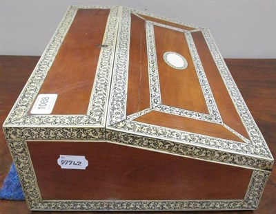 Lot 1088 - A 19th century Anglo-Indian Camphorwood and Ivory Inlaid Writing Slope, the ivory decorated...