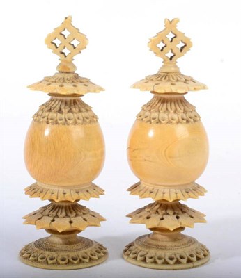 Lot 1097 - A Pair of Ivory Finials, late 19th century, of ovoid form with angular pierced borders, 9cm,...