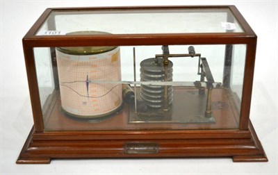 Lot 1101 - A Barograph, early 20th century, in a glazed mahogany case, 35cm wide overall
