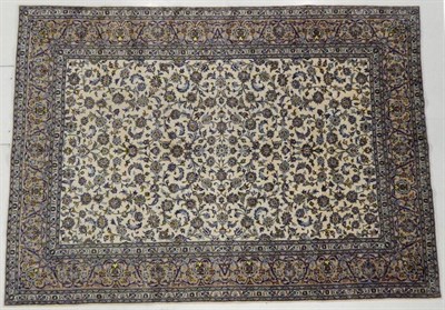 Lot 1174 - Kashan Carpet Central Iran, circa 1960 The ivory field with an all over design of scrolling...