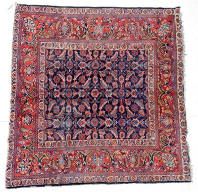 Lot 1176 - Feraghan Rug of unusual size West Iran, 20th century The indigo Herati field enclosed by meandering