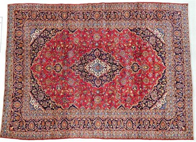 Lot 1218 - Kashan Carpet Central Iran, circa 1970 The crimson field of palmettes and vines around an...
