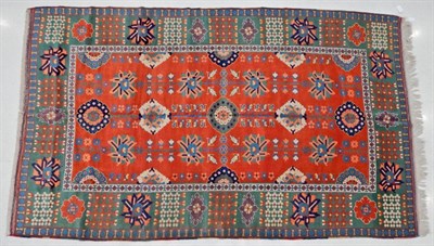 Lot 1220 - West Anatolian Carpet, late 20th century The terracotta field of plants and large flower heads...