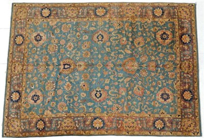 Lot 1221 - Indian Carpet, 20th century The green/blue field with an allover design of palmettes and vines...