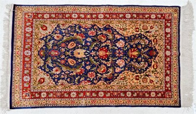 Lot 1223 - Hereke Silk Prayer Rug North west Anatolia, circa 1970 The indigo floral field beneath the...