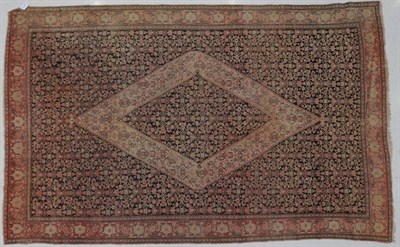 Lot 1225 - Senneh Rug Iranian Kurdistan, circa 1900 The charcoal Herati field centred by a stepped...