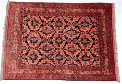 Lot 1227 - Turkmen Carpet North West Afghanistan, modern The midnight blue field with rows of medallions...