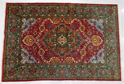 Lot 1228 - Very Finely Woven Petag Design Carpet, 20th century The raspberry field centred by a cusped...