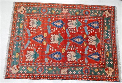 Lot 1229 - Konya Carpet  Central/West Anatolia, circa 1980 The madder field with a one way design of large...