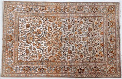 Lot 1233 - Part Silk Kashan Rug Central Iran, circa 1940 The field with an urn issuing flowers surrounded...