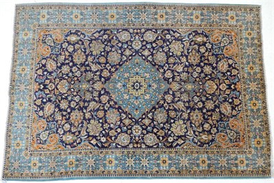 Lot 1236 - Tabriz Carpet Iranian Azerbaijan, circa 1970 The mid blue field of vines around a pale indigo...