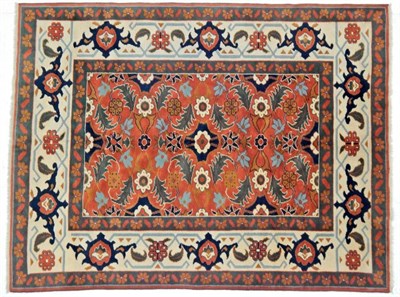 Lot 1238 - Modern Turkish Carpet The terracotta field of serrated leaves and flowerheads enclosed by ivory...
